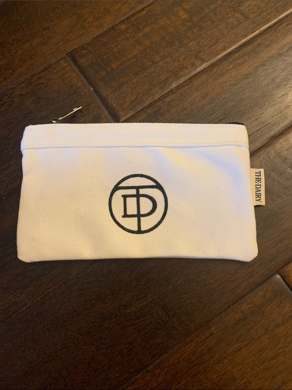The Dairy White Canvas Zip Pouch with Black Logo